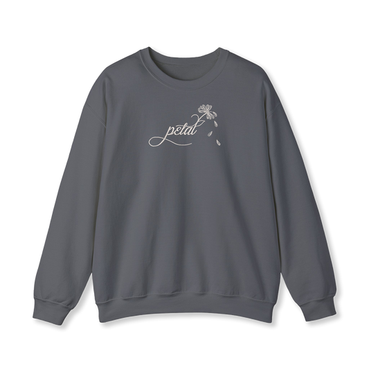 Dark grey sweatshirt with white embroidered “petal” script and daisy stem with falling petals on chest