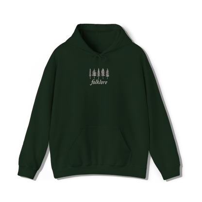 taylor swifts folklore album title embroidered alongside some trees on a forest green coloured hoodie