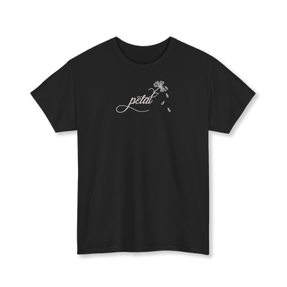 Black t-shirt featuring white embroidered cursive “petal” design with daisy stem and scattered petals