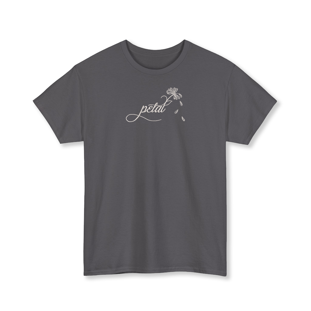 Dark grey t-shirt with white embroidered “petal” script and daisy stem with falling petals on chest